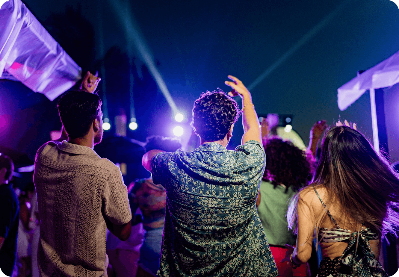 People dancing at an outdoor party.