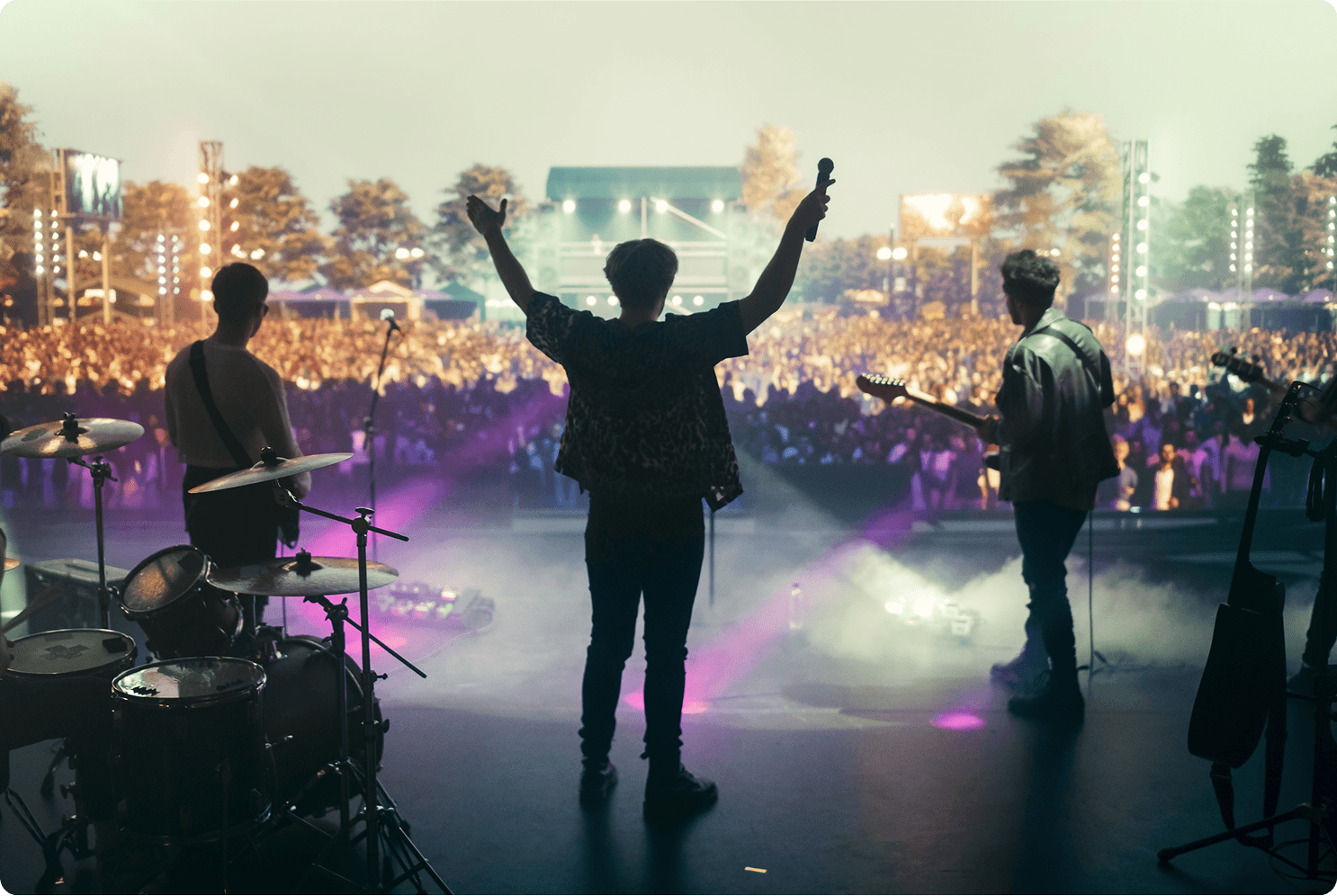 Band performing live at outdoor music festival.